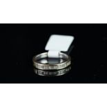 Baguette cut diamond half eternity ring, mounted in unmarked white metal tested as 18ct gold,