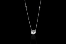 Diamond cluster necklace, set with 1 round brilliant cut diamond totalling 1.21ct, 4 claw set,