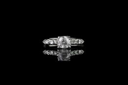 Diamond cluster ring, set with 1 round brilliant cut diamond totalling 0.76ct, 6 round brilliant cut