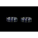 Pair of Sapphire and Diamond hoop earrings, set with 14 oval cut sapphires totalling 5.74 ct, 4 claw