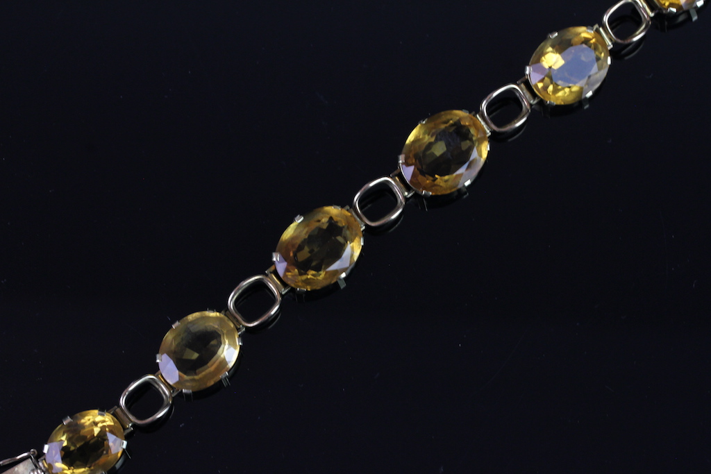 Citrine bracelet, mounted in yellow metal, set with six oval citrines, with tongue and box clasp, - Image 2 of 2