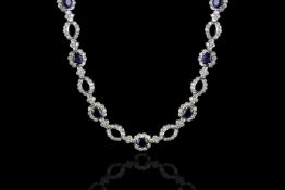 STUNNING SAPPHIRE AND DIAMOND NECKLET, set with 16 approx 5x4mm sapphires,approx 3.36 carat of