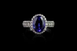 Tanzanite and Diamond ring, set with 1 oval cut tanzanite approximately 3.38ct, 4 claw set,