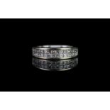 Half eternity diamond ring, set with 2 rows of a total of 32 princess cut diamonds, hallmarked