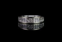 Half eternity diamond ring, set with 2 rows of a total of 32 princess cut diamonds, hallmarked