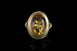 LARGE CITRINE ESTIMATED 17X 12 MM, chenier setting, hallmarked 18ct, ring size N, total weight 9.4