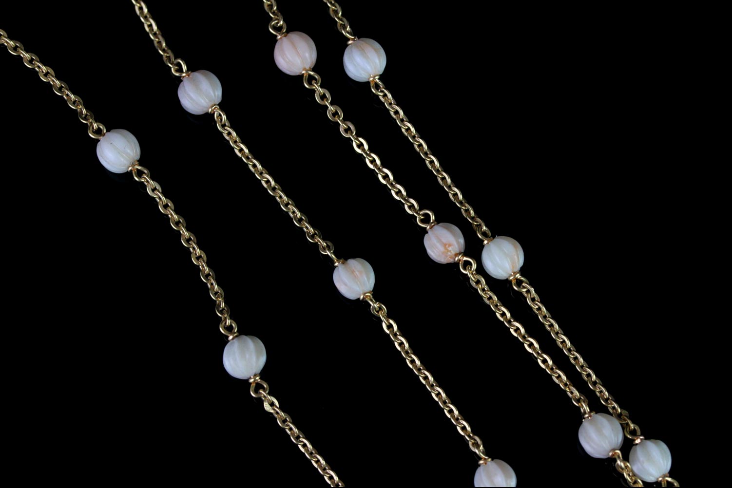 Carved coral bead necklace, 24 carved pale white/pink coral beads, gold belcher chain, stamped and