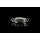 PLATINUM SEVEN STONE DIAMOND RING WITH GOLD LOVE KNOTS,estimated total weight 0.20 ct of brilliant