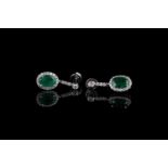 Pair of Emerald and Diamond earrings, set with 2 oval cut emeralds totalling 1.86ct, surrounded by