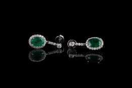 Pair of Emerald and Diamond earrings, set with 2 oval cut emeralds totalling 1.86ct, surrounded by