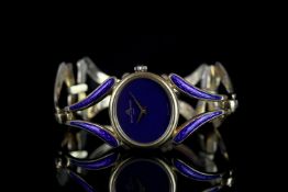 LADIES BAUME & MERCIER ENAMEL WRISTWATCH, oval lapis lazuli dial, stone set crown, 25mm 18ct