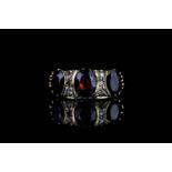 Garnet & diamond ring, centre garnet measuring approximately 8mm x 6mm, garnet measuring