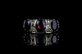 Garnet & diamond ring, centre garnet measuring approximately 8mm x 6mm, garnet measuring