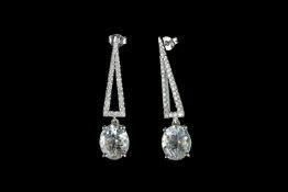 Pair of Aquamarine and Diamond earrings, set with 2 oval cut light blue aquamarines totalling 8.9ct,