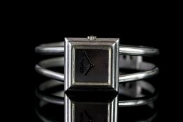 LADIES VINTAGE ROY KING SILVER BANGLE WATCH CIRCA 1970,silver dial with no markers, black hands,