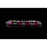 Ruby and Diamond bracelet, set with 10 marquise cut rubies totalling 14.47ct, 10 round brilliant cut