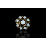 Opal ring, set with 9 cabochon cut opals totalling 5.02ct, hallmarked 14ct yellow gold, finger