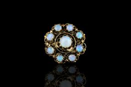 Opal ring, set with 9 cabochon cut opals totalling 5.02ct, hallmarked 14ct yellow gold, finger