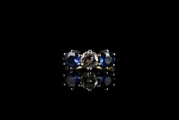 3 stone diamond & sapphire ring, round brilliant cut diamond set to the centre approximately 0.60ct,