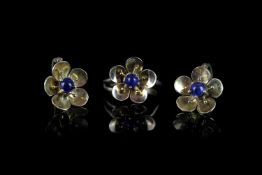 18CT CABOCHON SAPPHIRE FLOWER RING AND DROP EARRING SET, stones estimated at 4x4mm, makers mark
