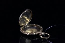 Victorian locket, 30mm circular case, heavily engraved with scrolling fauna detail, hinged gold lid,