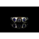 18CT 3 STONE GYPSY STYLE RING,sapphires estimated 3 x 3 mm each, single diamond estimated 0.05ct,