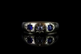 18CT 3 STONE GYPSY STYLE RING,sapphires estimated 3 x 3 mm each, single diamond estimated 0.05ct,