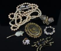 Selection of costume jewellery, including brooches and faux pearl necklaces