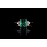 Emerald and Diamond ring, set with 1 emerald totalling 1.34ct, 4 claw set, 6 round brilliant cut