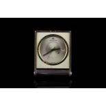 JAEGER -LE COULTRE TRAVEL CLOCK,oblong, champagne dial with black hands,black baton markers on the