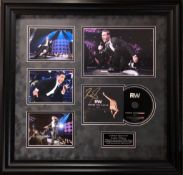 Robbie Williams, CD Sleeve signed by Robbie Williams. Professionally framed for supreme