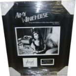 Amy Winehouse, Index card signed by Amy Winehouse. Autograph obtained at Camden - Market 2007.