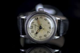 GENTLEMENS LONGINES TRE TACCHE WRISTWATCH, circular patina dial with arabic numerals and an outer