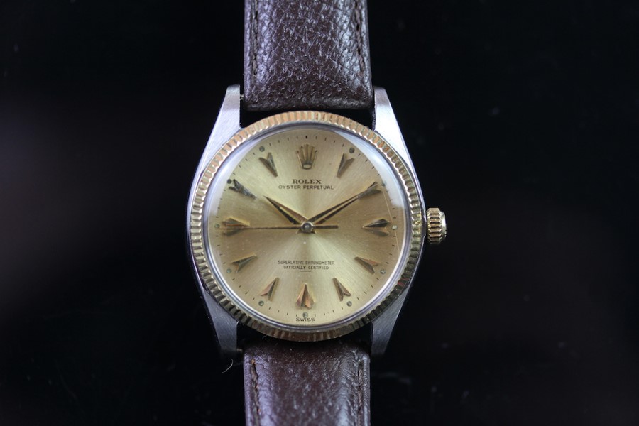 GENTLEMEN'S ROLEX OYSTER PERPETUAL STEEL AND GOLD WRISTWATCH, circular gold dial with faceted dagger