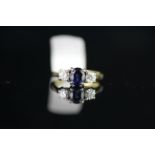 18CT SAPPHIRE AND DIAMOND 3 STONE RING,sapphire estimated 6.2x4.8x3.45mm,each side is a diamond