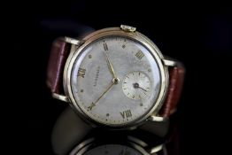 GENTLEMENS LONGINES 9CT GOLD OVERSIZE STEPPED DRESS WRISTWATCH, circular patina dial with gilt roman