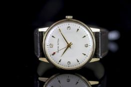 GENTLEMENS SMITHS ASTRAL 9CT GOLD WRISTWATCH, circular silver dial with gold hour markers and hands,