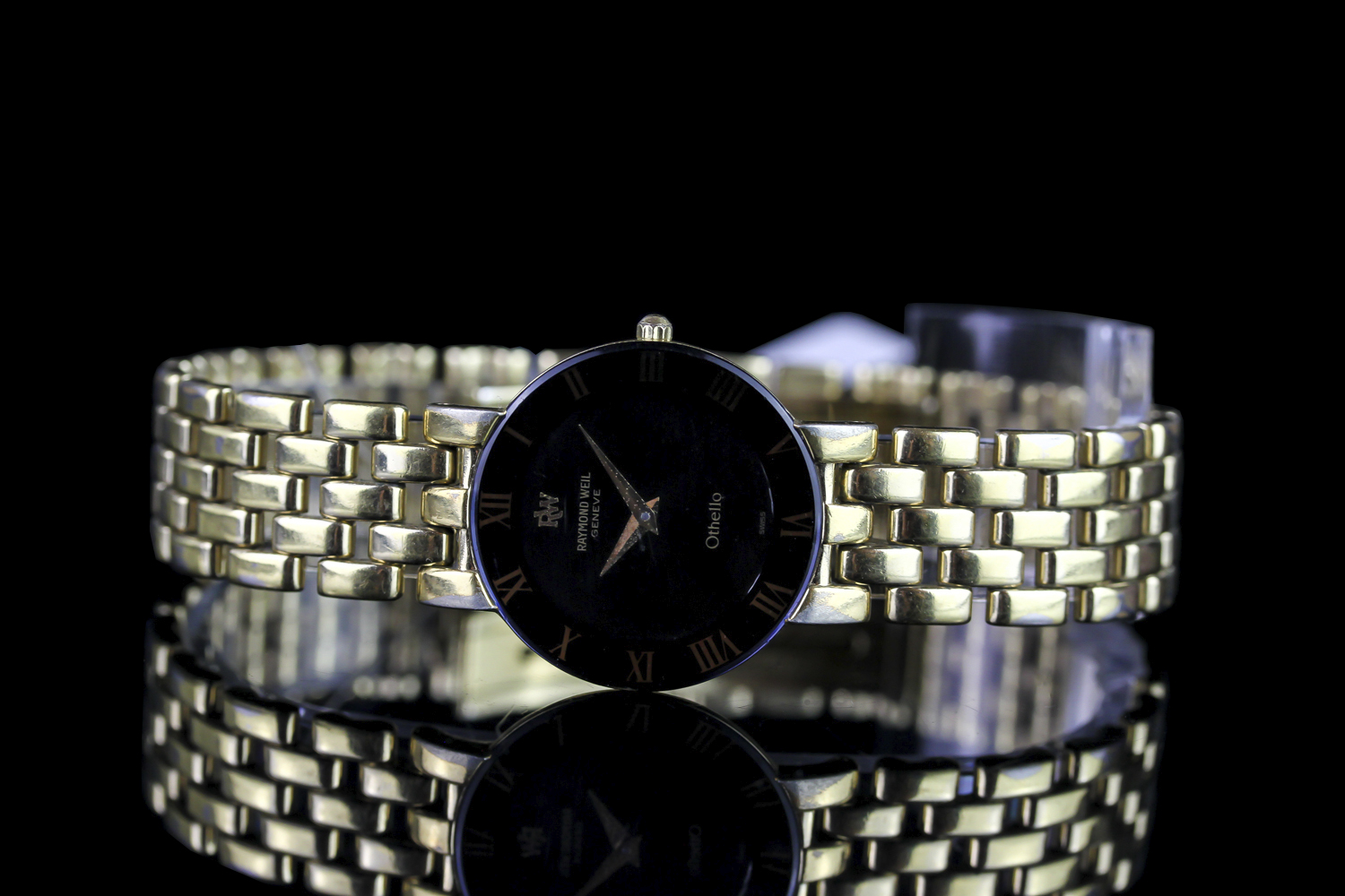 LADIES RAYMOND WEIL OTHELLO,round,black dial and black hands,gold roman numeral markers, 24mm