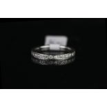 Full eternity diamond ring, set with round brilliant diamonds, finger size P, white metal shank