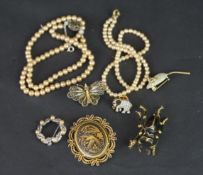 Selection of costume jewellery, including brooches and faux pearl necklaces