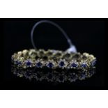 STUNNING 18K SAPPHIRE AND DIAMOND BRACELET, formed 21 clusters, each cluster is formed from a