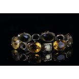 Citrine bracelet, mounted in yellow metal, set with six oval citrines, with tongue and box clasp,