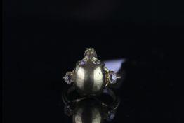 18CT DIAMOND SET SKULL RING,total weight 8gms,ring size M.hallmarked.