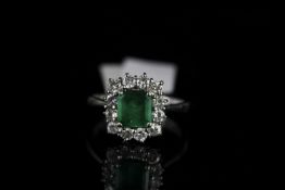 18CT WHITE GOLD EMERALD AND DIAMOND CLUSTER RING,emerald estimated 6.3x 6.4mm, hallmarked , ring