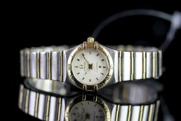 LADIES OMEGA STEEL AND GOLD CONSTELLATION, circular textured off white dial with gold hour markers