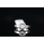 18CT WHITE GOLD DIAMOND SET PAVE HEART RING WITH MOVING DIAMOND,total weight 6 gms, ring size P.