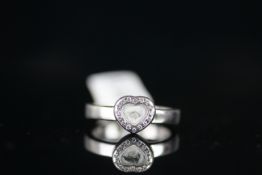 18CT WHITE GOLD DIAMOND SET PAVE HEART RING WITH MOVING DIAMOND,total weight 6 gms, ring size P.