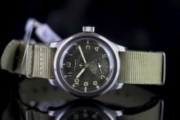 GENTLEMENS CYMA MILITARY WRISTWATCH, circular black dial with arabic numerals and luminous hour