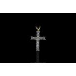 18CT DIAMOND SET CROSS WITH NO CHAIN,stones estimated total weight 0.45ct,hallmarked.