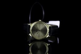 LADIES PIAGET WRISTWATCH, circular champagne dial with hour markers, textured bezel and lugs, 24mm